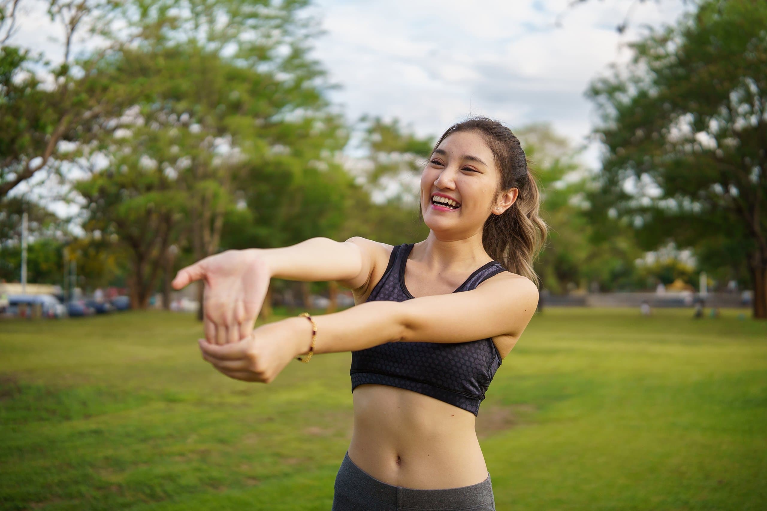 happy woman exercising stretching