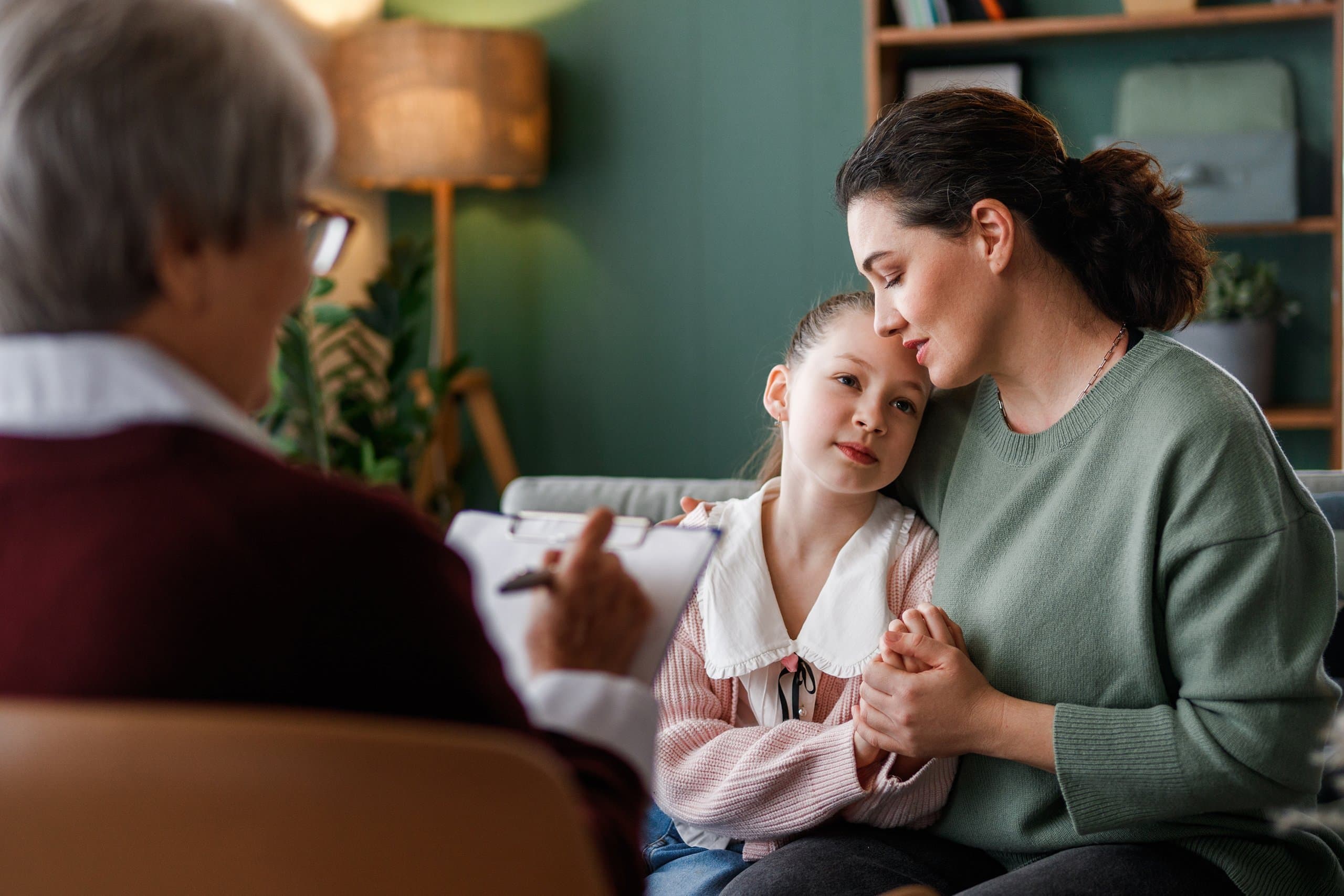 mother comforts daughter during counselling