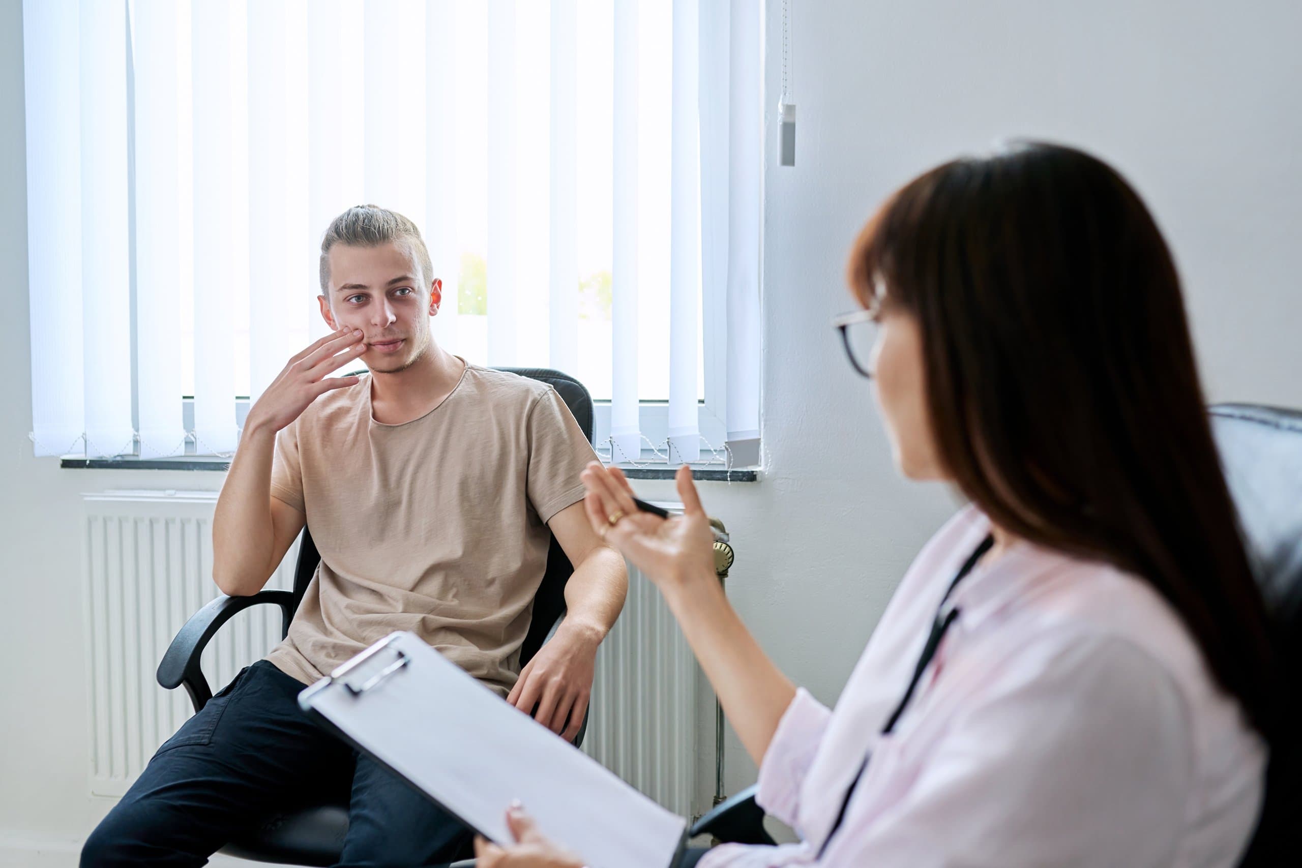 man talking with counsellor