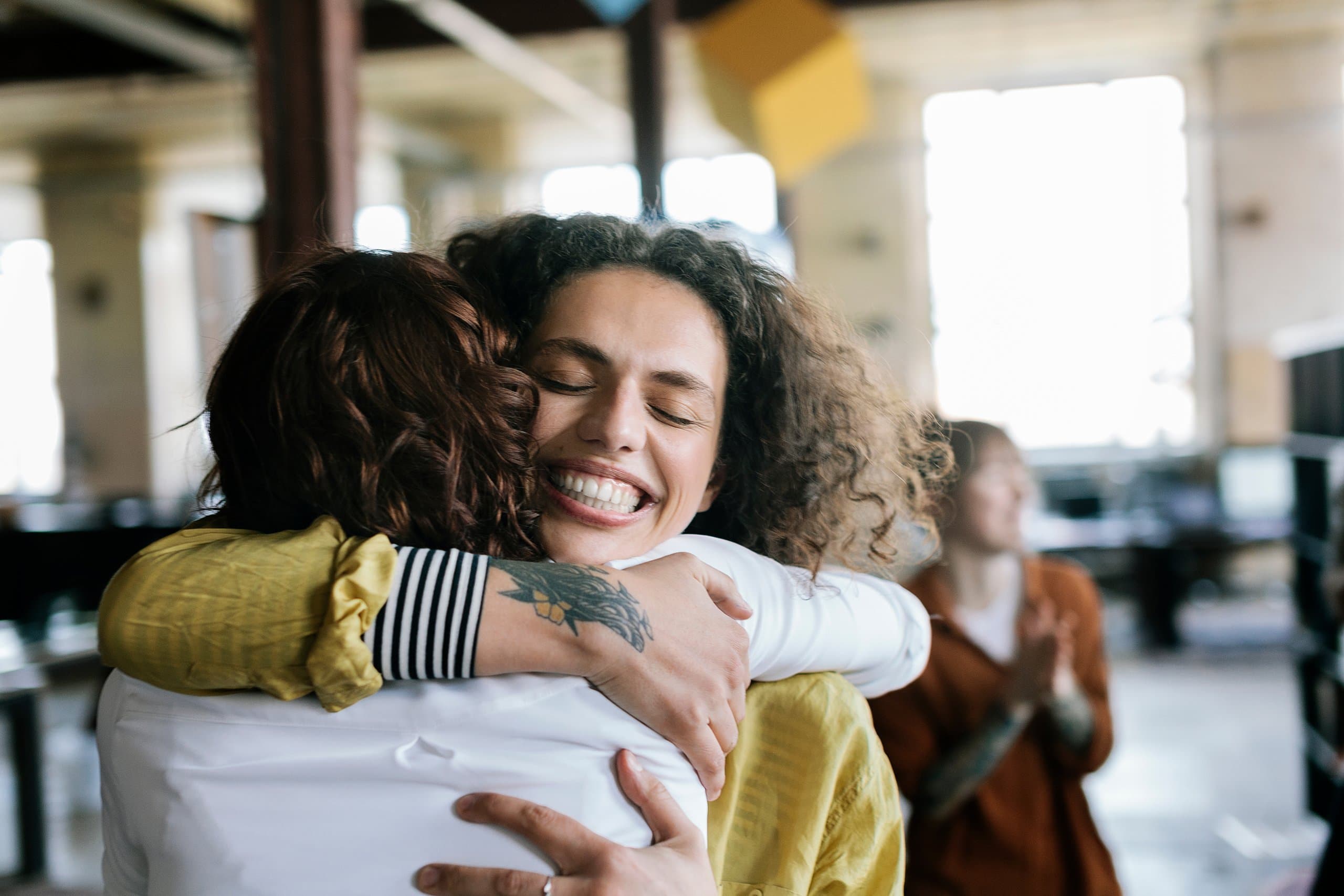 woman hugging and smiling