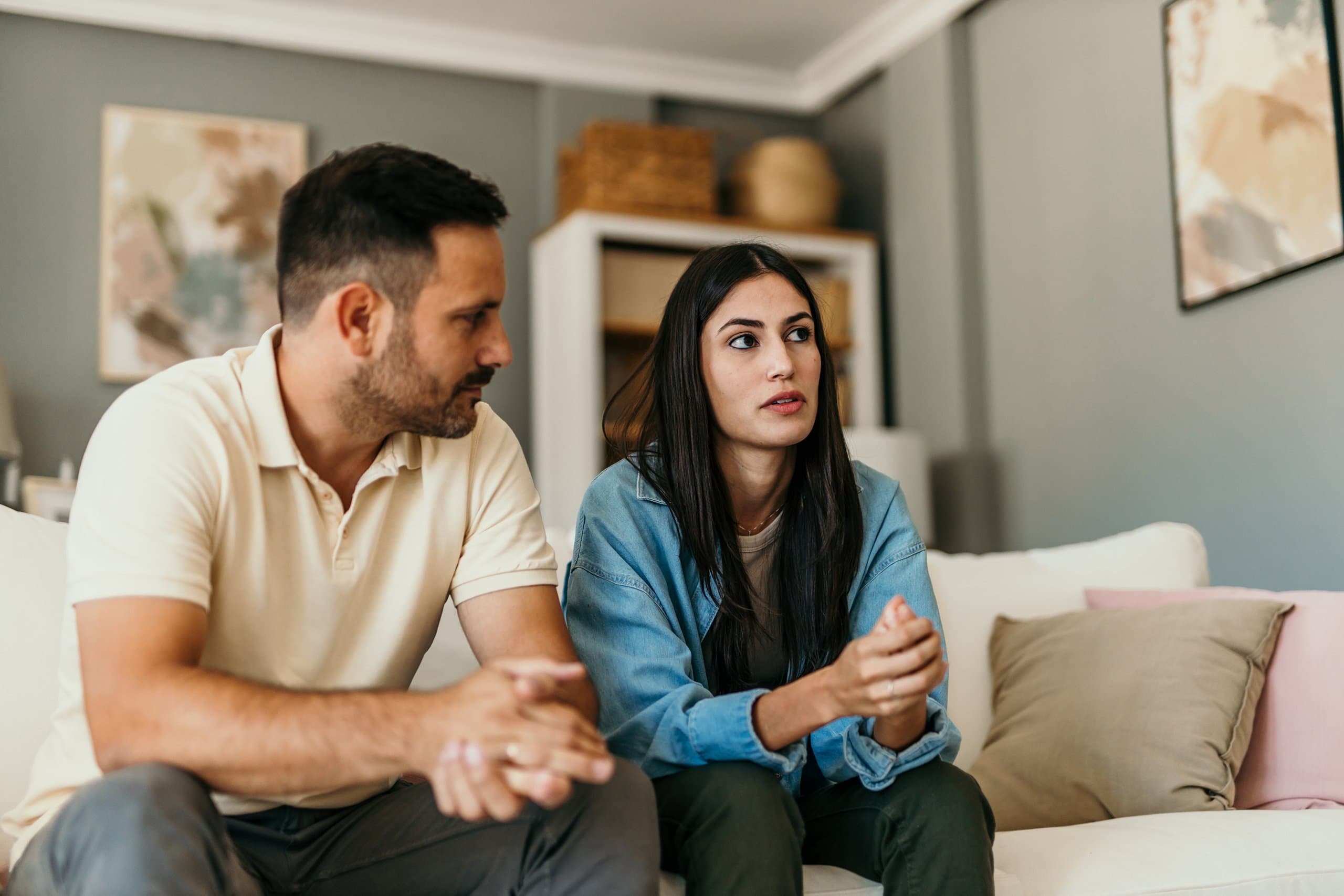 couple talking on couch in counselling