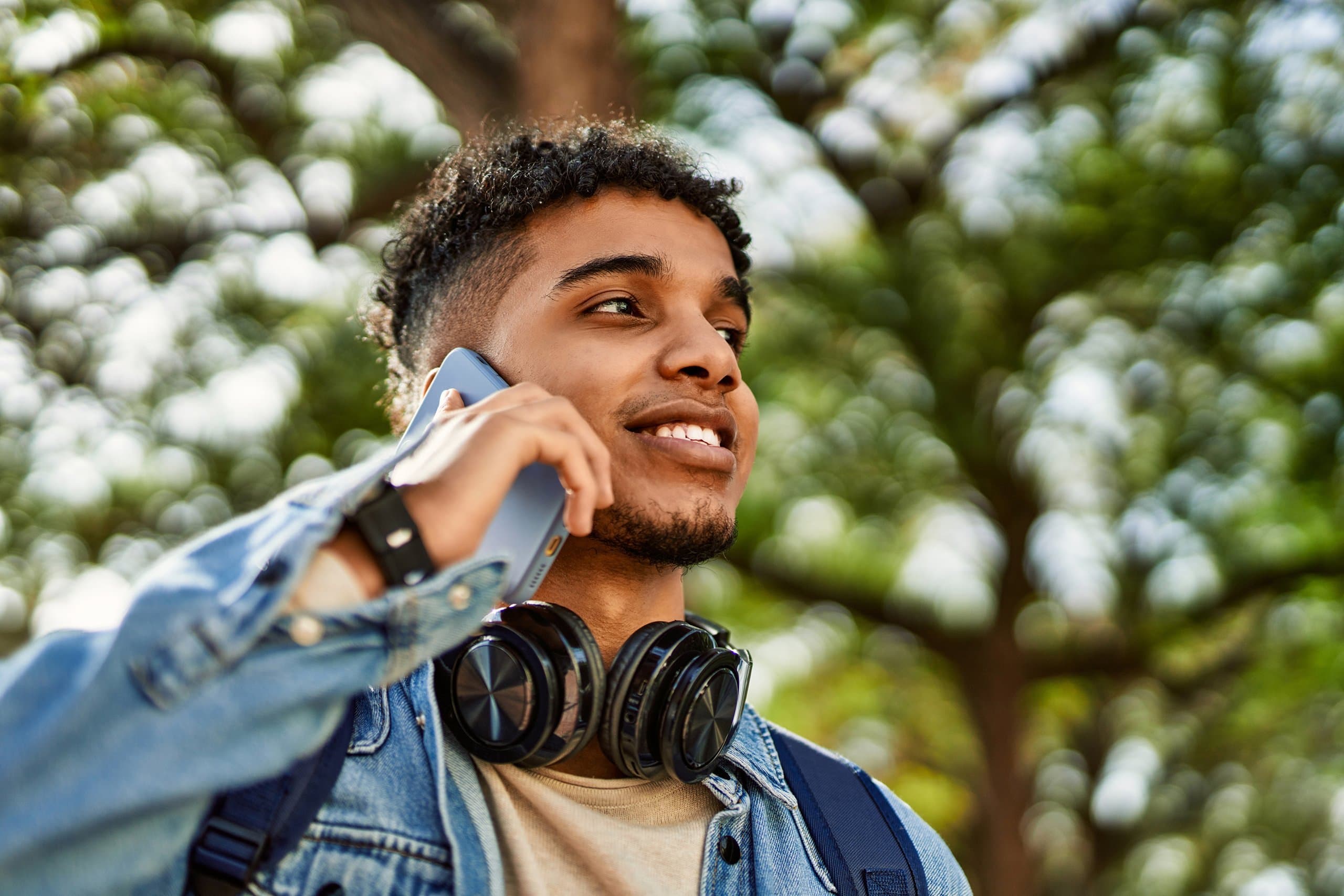 young man outside on phone